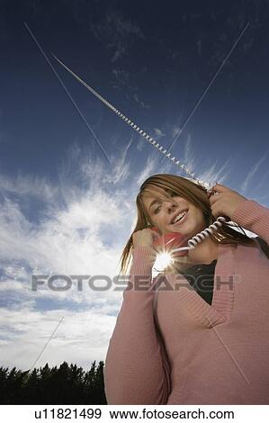 Woman talking on phone View Large Photo Image Stock Photo - Woman talking on phone. Fotosearch
