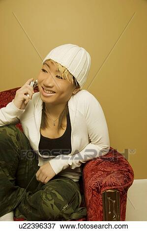 Stock Photo - Woman using cell phone. Fotosearch