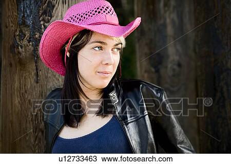 Woman wearing pink cowboy hat View Large Photo Image Stock Image - Woman wearing pink cowboy hat. Fotosearch