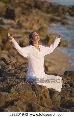 Woman with arms raised View Large Photo Image Stock Image - Woman with arms raised. Fotosearch