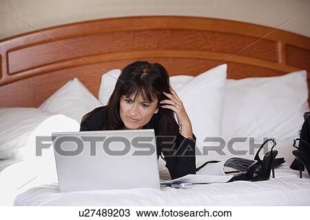 Stock Image - Woman working on computer. Fotosearch