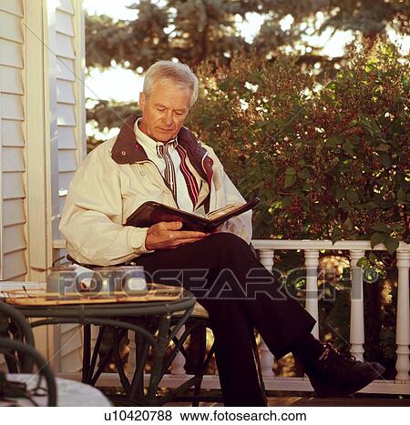 Stock Photo - A man reading his Bible. Fotosearch