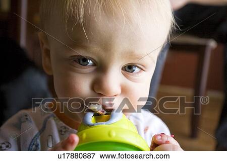 Baby with cup View Large Photo Image Stock Photo - Baby with cup. Fotosearch
