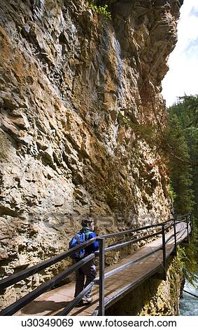 Boy walking along Johnson Canyon, Banff, Alberta, Canada View Large Photo Image Stock Photo - Boy walking along Johnson Canyon, Banff, Alberta, Canada. Fotosearch