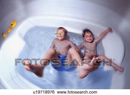 Stock Photograph - Boys playing in the bathtub. Fotosearch