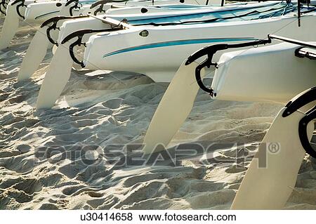 Stock Photo - Catamarans on the beach. Fotosearch