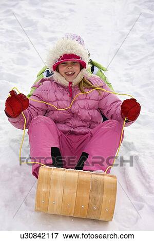 Children tobogganing View Large Photo Image Stock Photo - Children tobogganing . Fotosearch