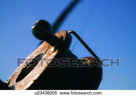 Stock Photography - Closeup of a fishing reel. Fotosearch