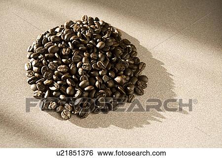 Stock Photograph - Coffee beans in a pile. Fotosearch