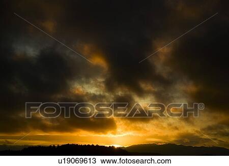 Dark clouds and a sunset View Large Photo Image Stock Image - Dark clouds and a sunset. Fotosearch
