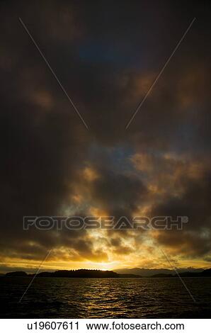 Dark clouds and a sunset View Large Photo Image Stock Image - Dark clouds and a sunset. Fotosearch