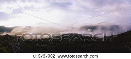 Stock Image - Early morning mist, Caha Pass, Glengarriff, Co Cork, Ireland. Fotosearch