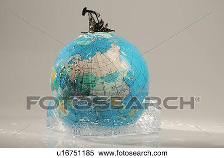 Stock Photography - Globe in ice with oil derek. Fotosearch