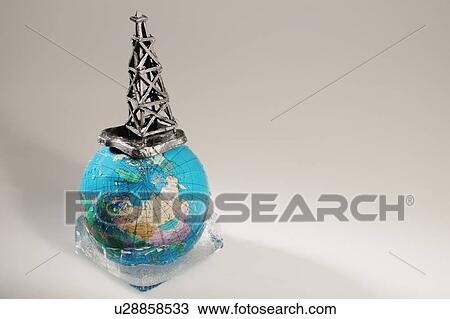 Globe in ice with oil drilling rig View Large Photo Image Stock Image - Globe in ice with oil drilling rig. Fotosearch