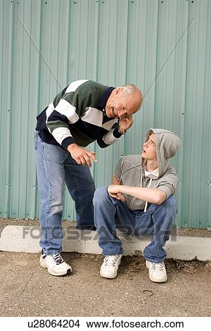 Grandfather and grandson listening to music View Large Photo Image Picture - Grandfather and grandson listening to music. Fotosearch