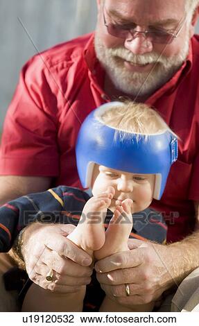 Grandpa playing with grandson View Large Photo Image Stock Image - Grandpa playing with grandson. Fotosearch