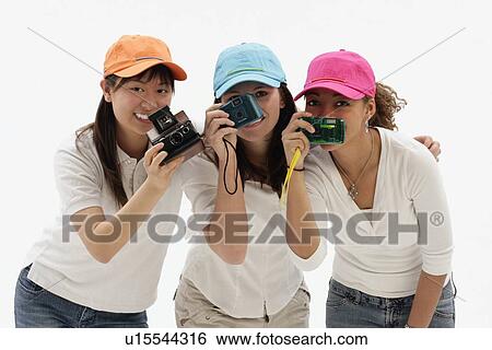 Group of friends with cameras View Large Photo Image Stock Photograph - Group of friends with cameras. Fotosearch
