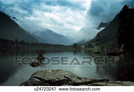 Mountain lake in the Alps in Germany View Large Photo Image Stock Photo - Mountain lake in the Alps in Germany. Fotosearch