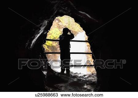 Stock Image - Person at Johnson Canyon, Banff, Alberta, Canada. Fotosearch