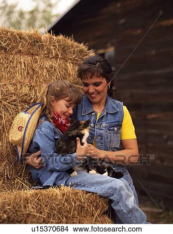 Picture - Playing with a puppy. Fotosearch