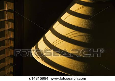 Shadow of blind on lamp shade View Large Photo Image Picture - Shadow of blind on lamp shade. Fotosearch
