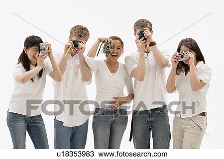 Stock Image - Teens with cameras. Fotosearch