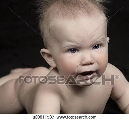 Stock Photo - Unhappy baby. Fotosearch