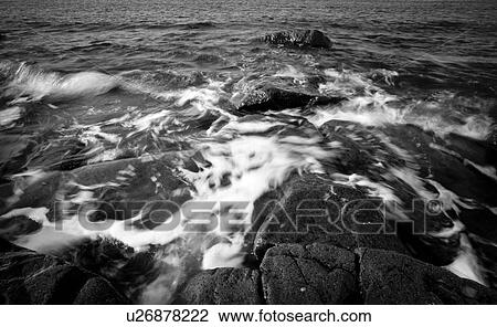 Stock Image - Water over rocks. Fotosearch