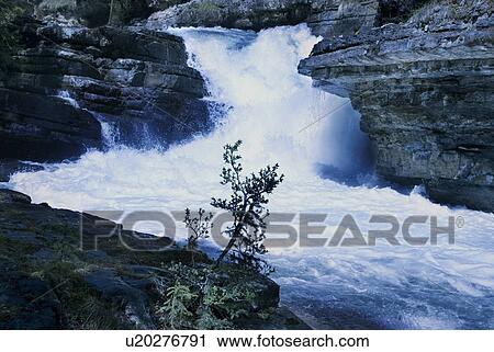 Stock Image - Waterfall in Johnson Canyon, Banff, Alberta, Canada. Fotosearch