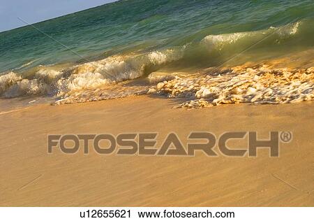 Waves rolling in on tropical beach View Large Photo Image Stock Image - Waves rolling in on tropical beach. Fotosearch