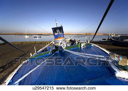 Stock Photography - A boat on shore, Amble, Northumberland, England. Fotosearch