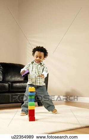 A boy playing with blocks View Large Photo Image Stock Photo - A boy playing with blocks. Fotosearch