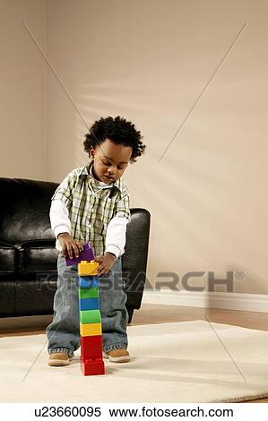 A boy playing with blocks View Large Photo Image Stock Photography - A boy playing with blocks. Fotosearch