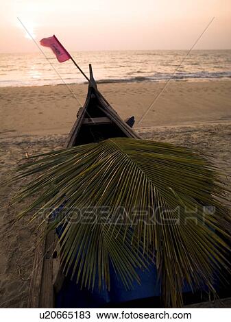 A canoe on the beach at the Arabian Sea, Kerala, India View Large Photo Image Stock Image - A canoe on the beach at the Arabian Sea, Kerala, India . Fotosearch