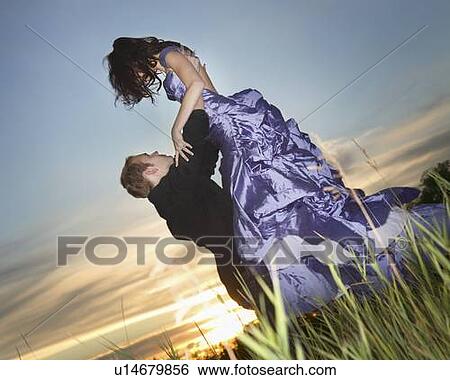 A man lifting his prom date View Large Photo Image Stock Photograph - A man lifting his prom date. Fotosearch