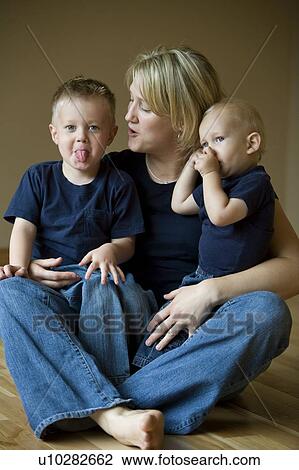 A mother with two sons View Large Photo Image Stock Image - A mother with two sons. Fotosearch