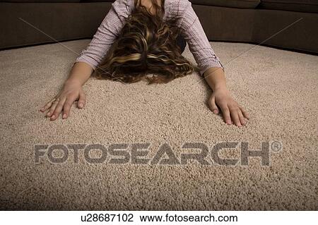 Stock Image - A woman praying. Fotosearch