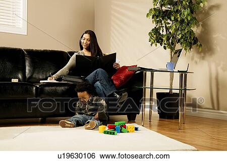 A woman working at home View Large Photo Image Stock Photograph - A woman working at home. Fotosearch