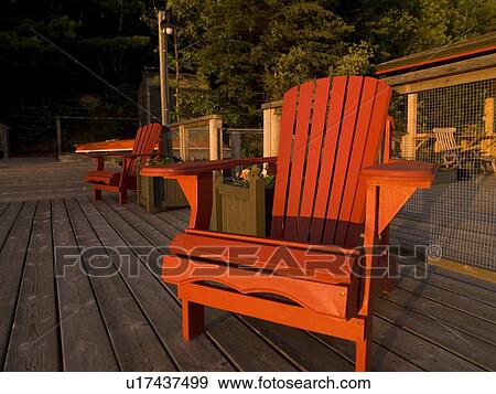Adirondack chairs on a dock, Lake of the Woods, Ontario, Canada View Large Photo Image Stock Photo - Adirondack chairs on a dock, Lake of the Woods, Ontario, Canada. Fotosearch