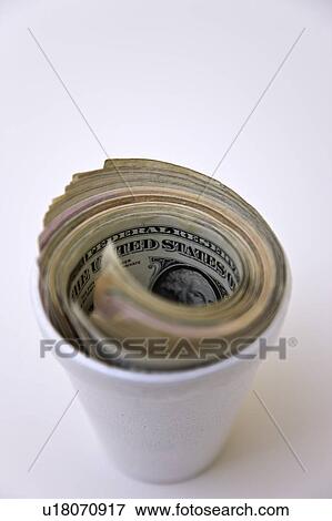 Stock Photo - American paper currency in styrofoam cup. Fotosearch