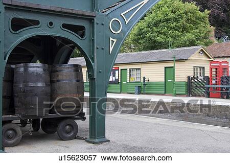 Stock Photo - Barrels On A Cart In A Train Station. Fotosearch