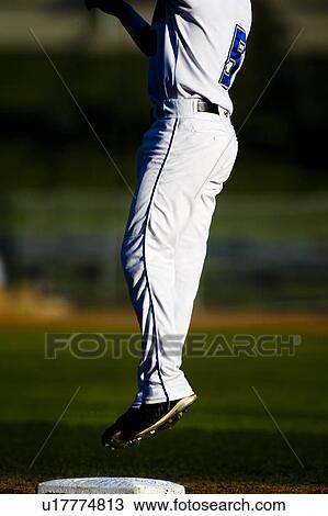 Baseball player jumping View Large Photo Image Stock Image - Baseball player jumping. Fotosearch