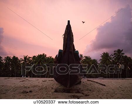 Boat on shore, Arabian Sea, Kerala, India View Large Photo Image Stock Photo - Boat on shore, Arabian Sea, Kerala, India . Fotosearch