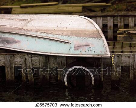 Boat resting upside down on a dock View Large Photo Image Stock Image - Boat resting upside down on a dock. Fotosearch