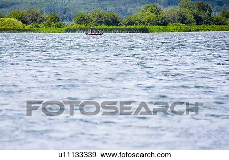 Boating on a lake View Large Photo Image Stock Photo - Boating on a lake. Fotosearch
