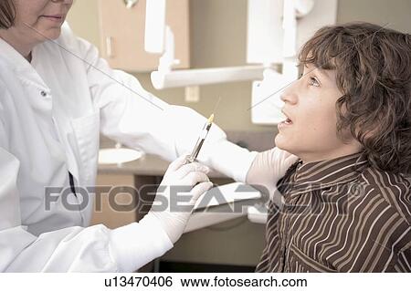 Stock Photograph - Boy about to get needle. Fotosearch