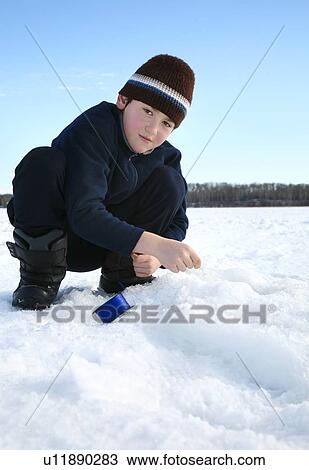 Boy ice fishing View Large Photo Image Stock Image - Boy ice fishing. Fotosearch