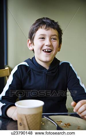 Boy just finished eating View Large Photo Image Stock Photo - Boy just finished eating. Fotosearch