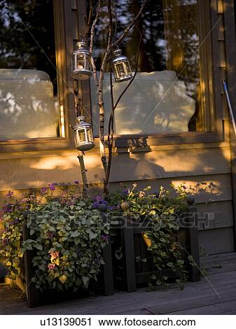 Stock Image - Candles on the front of a house. Fotosearch