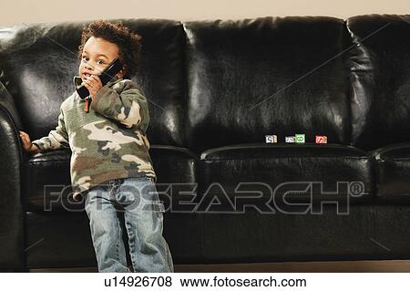 Stock Photo - Child with cell phone. Fotosearch